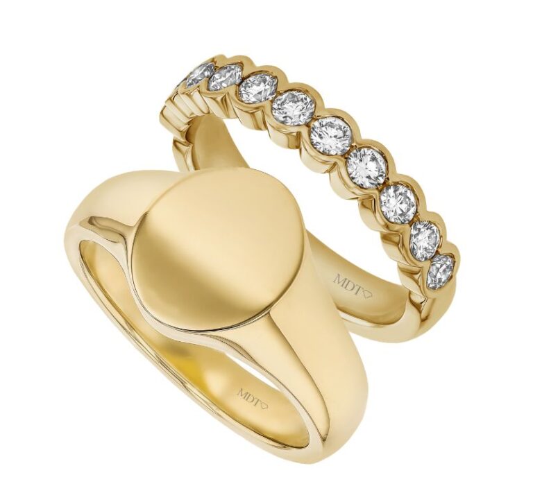 Matching yellow gold wedding rings by MDT DESIGN, featuring a classic signet ring paired with a diamond-set wedding band, handmade in Melbourne.