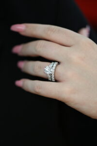 handmade Diamond engagement ring paired with matching diamond wedding bands, showing carefully considered stone size, spacing and proportions for a seamless fitted set.