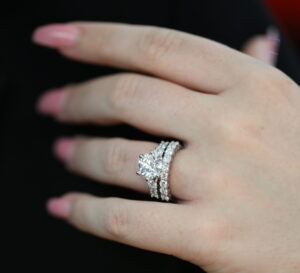 handmade Diamond engagement ring paired with matching diamond wedding bands, showing carefully considered stone size, spacing and proportions for a seamless fitted set.