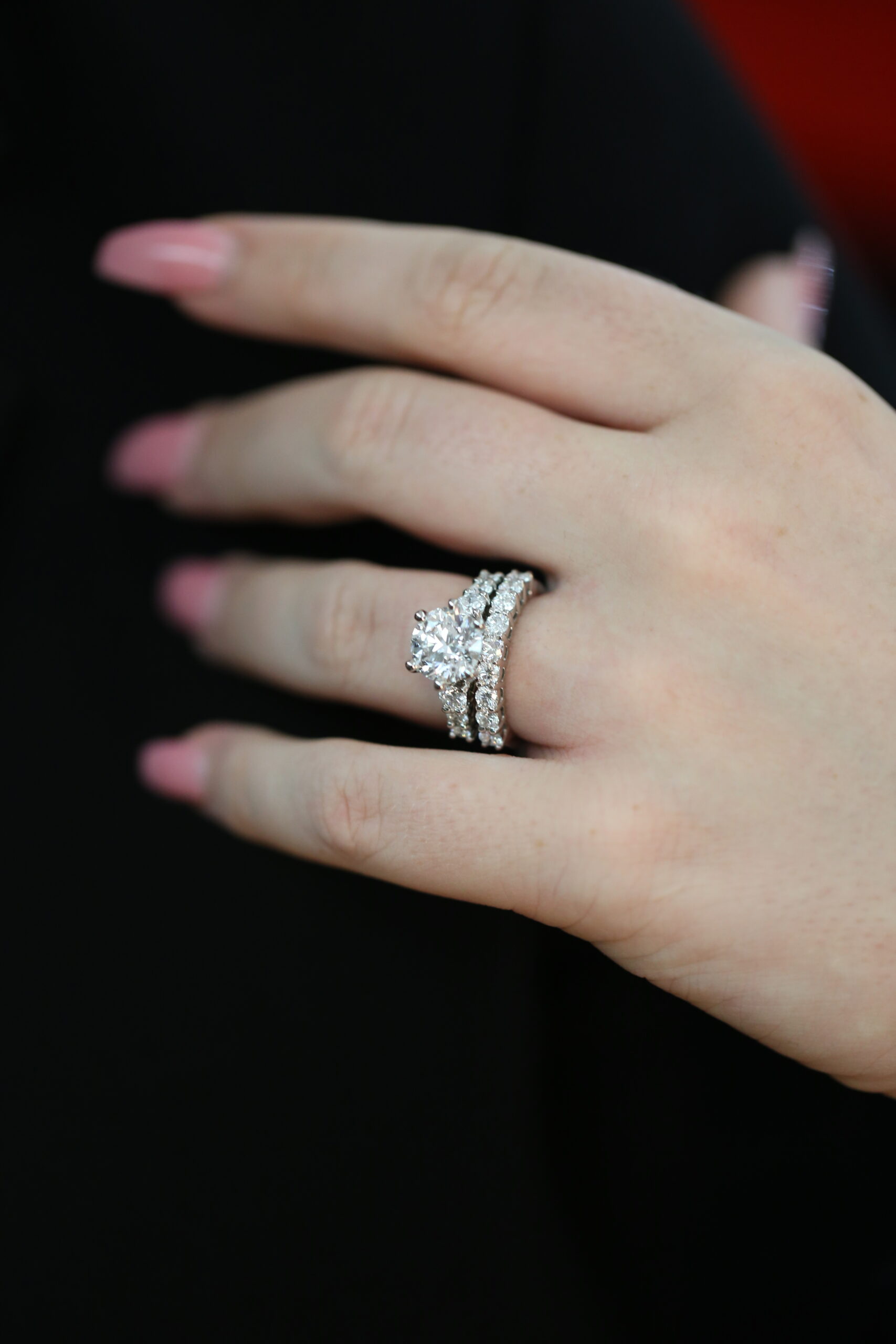 handmade Diamond engagement ring paired with matching diamond wedding bands, showing carefully considered stone size, spacing and proportions for a seamless fitted set.