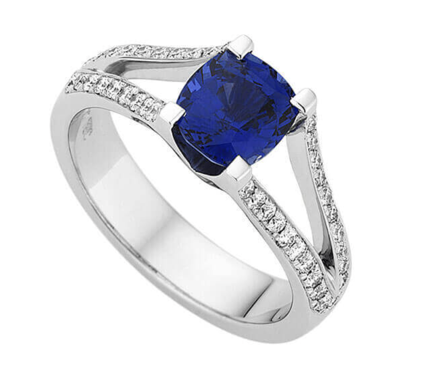 Introducing our Split Band Diamond and Ceylon Sapphire Ring C1200, a timeless piece that seamlessly blends tradition with modernity. Handmade on-site in our Melbourne jewellery workshop from platinum, this ring features a captivating 2.30ct oval Ceylon sapphire as its centrepiece, accented by 46 round brilliant cut diamonds along the split band.