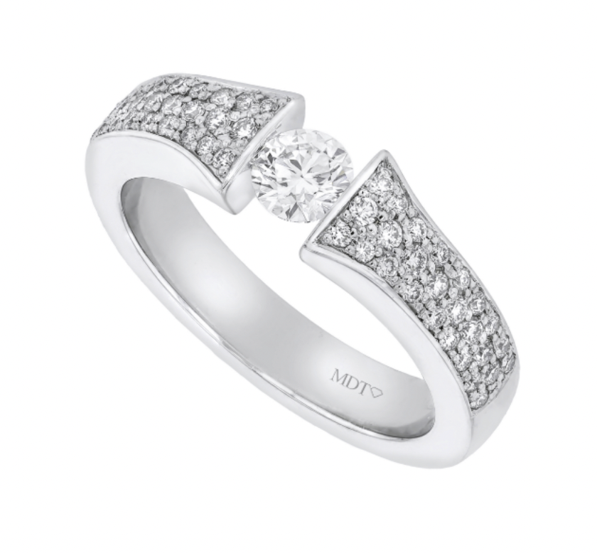 Round brilliant diamond tension set ring with a pavé-set diamond band, handmade in platinum by MDT DESIGN.